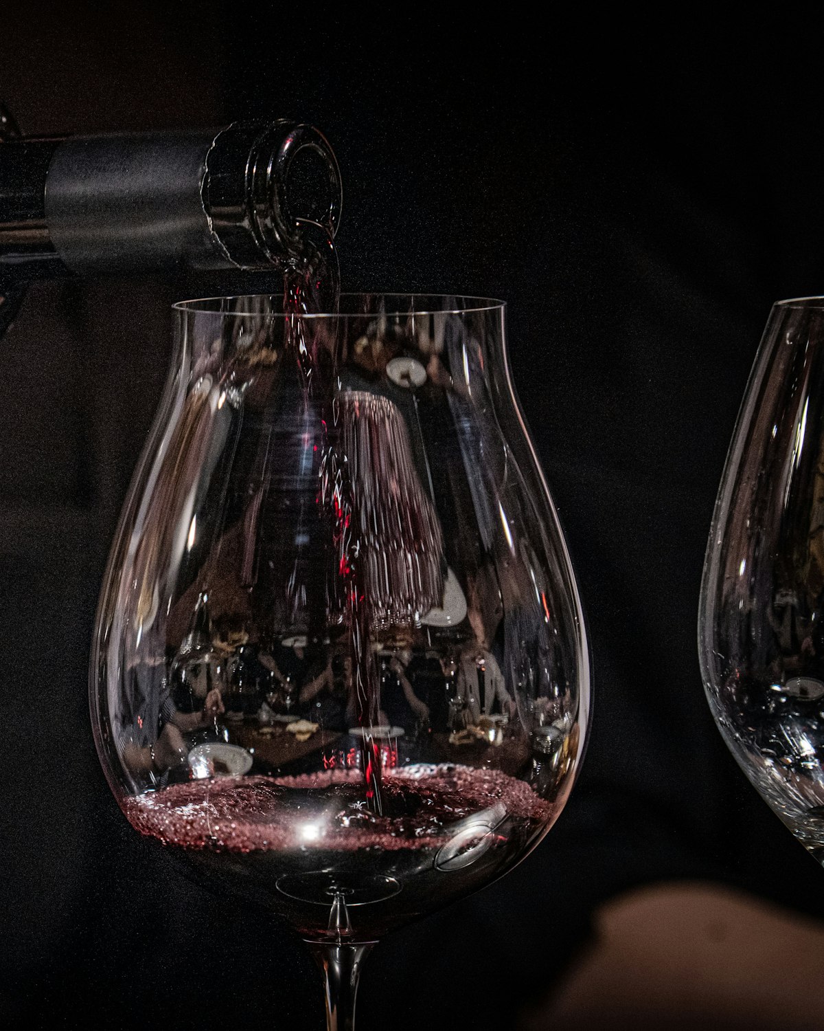 Red wine poured by candlelight